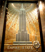 New York's famous Empire State Building, a New York City Landmark and a National Historic Landmark, soars more than a quarter of a mile into the atmosphere above the heart of Manhattan. Located on the 86th floor, 1,050 feet (320 meters) above the city's bustling streets, the Observatory offers panoramic views from within a glass enclosed pavilion and from the surrounding open-air promenade